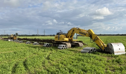 Yellow backhoe in a field